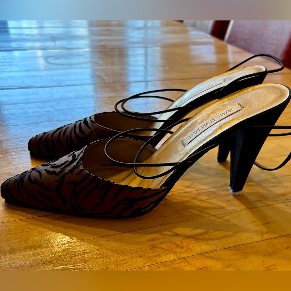 Ann Marino kitten heel pumps with a brown and black animal print design